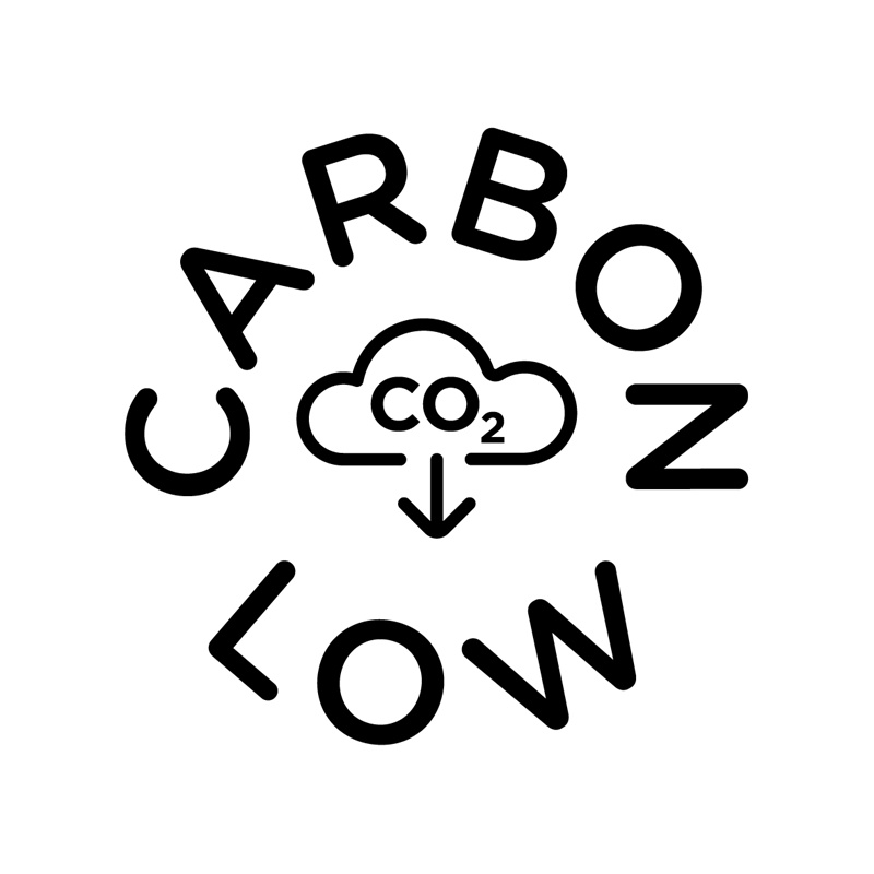 A black and white icon with the text "Carbon low" in capital letters written in a circle. There is a cloud with an arrow pointing downwards in the middle of the circle. Inside the cloud it says CO2.