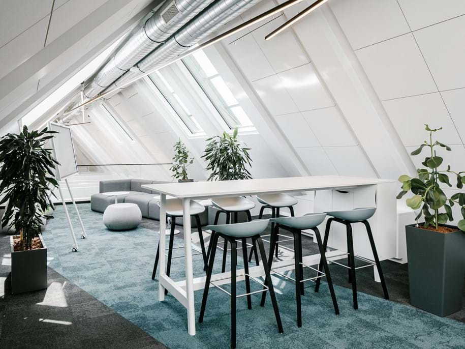 Acoustic ceiling fixed to the soffit in office meeting room