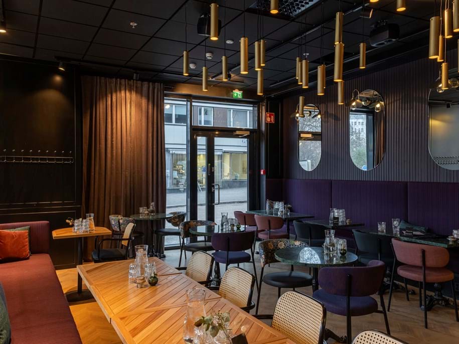 Black, suspended acoustic ceiling in restaurant