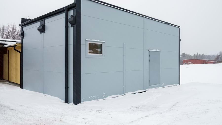 Exterior of prefabricated module for healthcare services in a snowy landscape