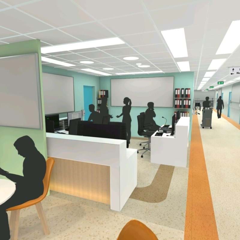 A modern hospital reception area with open workspaces, featuring desks, computers, and seating. Silhouetted people are working, talking, and using electronic devices. Wall-mounted TV shows weather, and there are signs and folders organised on shelves.