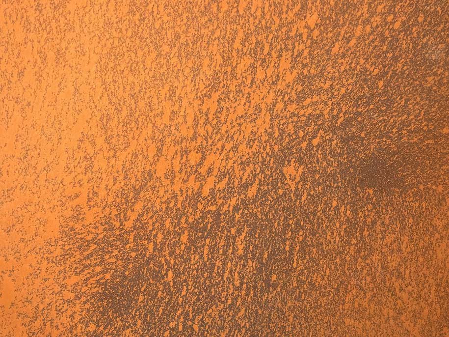 Close-up of acoustic plaster with rust appearance