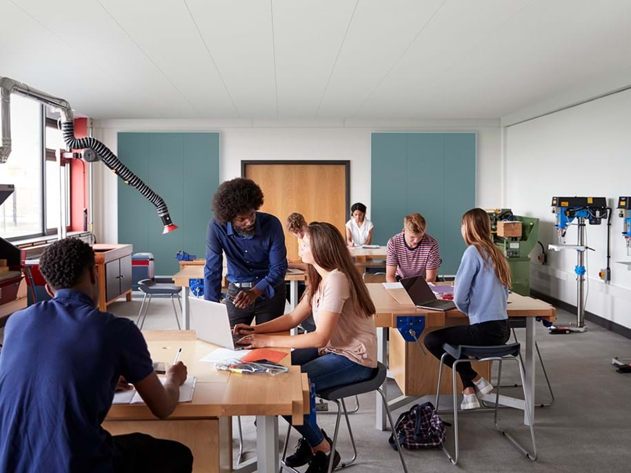 Teacher and students in classroom with wall absorbers